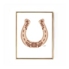 a drawing of a horse shoe with flowers on the front and side, in a gold frame