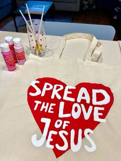 a bag with the words spread the love of jesus on it