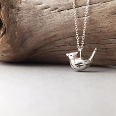 " Cardinals appear when angels are near."  - unknown  Handcrafted in pure silver, this sweet dainty Cardinal charm suspends off a 16" sterling silver chain- makes an ideal gift just in time for the holidays! ($55)  #animaljewelry #daintyjewelry #silverjewelry Handmade Silver Necklace For Christmas, Whimsical Bird Design Jewelry For Gifts, Whimsical Bird Design Jewelry For Gift, Handmade Bird-shaped Necklace For Gift, Handmade Bird-shaped Jewelry For Gifts, Handmade Bird-shaped Jewelry Gift, Birds In Winter, Grabby Hands, Pear Shaped Diamond Necklace