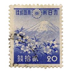 a stamp with flowers and mountains on it