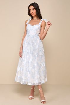 There's no better start to a perfect occasion than the Lulus Beautifully Adored White Floral Burnout Tie-Strap Midi Dress! Lightweight woven fabric, with a darling floral print and burnout texture throughout, shapes tying shoulder straps that support a sweetheart neckline and a bustier-style bodice with seamed cups. Fitted waist tops a skater skirt that ends at a midi hem. Hidden zipper/clasp at back. Fit: This garment fits true to size. Length: Mid-calf length. Size medium measures 49" from adj Chitenge Dresses, Knot Tie Dress, Shower Dress For Bride, Graduation Attire, Blue Floral Sundress, Tie Strap Dress, Midi Dress Floral, Floral Bustier, Bridal Shower Dress