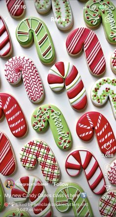 many decorated cookies are displayed on a white surface with red, green and white designs