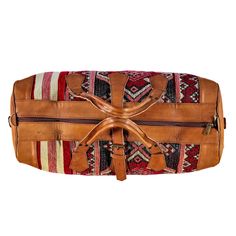 Handcrafted Vegetable-Tanned Cognac Leather and Kilim Duffel Bag: Tradition & Adventure Discover a travel companion beyond the ordinary. Our handcrafted duffel bag merges the rich heritage of vegetable-tanned top-grain leather with the vibrant artistry of unique kilim designs. Each kilim panel is a captivating story woven by skilled artisans. This fusion elevates your style and complements your adventurous spirit. Unveiling the Legacy of Your Duffel: Sustainable Luxury: Crafted from 100% vegetab Brown Vegetable-tanned Satchel For Travel, Artisan Travel Shoulder Bag With Leather Lining, Traditional Brown Travel Bag With Leather Handles, Artisan Shoulder Bag With Leather Lining For Travel, Artisan Shoulder Bag For Travel With Leather Lining, Traditional Rectangular Duffle Bag For Travel, Travel Tote Bag With Vegetable-tanned Leather, Rectangular Vegetable-tanned Satchel For Travel, Traditional Brown Rectangular Weekender Bag