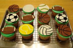 cupcakes decorated like sports balls and tennis balls on a cooling rack, ready to be eaten