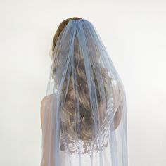 the back of a woman's head wearing a veil