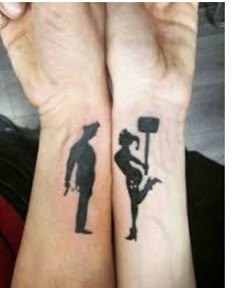 two people with matching tattoos on their arms