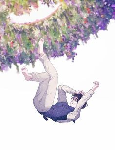 a man falling off his skateboard in the air next to a flowery tree