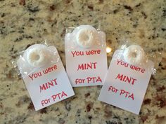 three donuts are wrapped in plastic and labeled with you were mint for pta