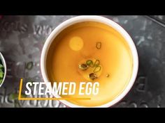 two bowls filled with soup next to each other on top of a metal countertop