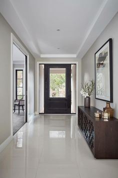 the hallway is clean and ready for us to use as an entrance way in this home