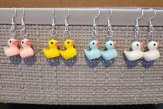 Cute duck dangling earrings made with 925 silver-plated copper hypoallergenic earring hooks. Ducks come in 4 different colors. The size of the ducks is 2 cm by 1.8 cm. Cute Duck, Disney Bag, Earring Holder, Hypoallergenic Earrings, Dangling Earrings, Earring Hooks, Etsy Earrings Dangle, Cute Disney, Ducks