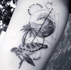 a black and white photo of a woman's leg with a tattoo on it