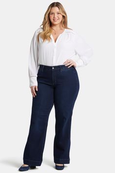 One way to stand out is to rock a bold, trendsetting pair of jeans. The Teresa Trouser Jeans in Plus Size by NYDJ don’t just stand out—they steal the show. Our Lift Tuck® Technology is made to help you keep your shape, with a proprietary slimming panel with a patented criss-cross design that smooths and sculpts. These trouser jeans feature a wide leg opening, non-functional back welt pockets and a zip fly with button closure. This jean is made with earth-friendly methods that result in reduced consumption of water, chemicals and/or energy. | NYDJ Women's Teresa Trouser Jeans In Plus Size in Burbank Wash, Size: 22W | Denim Cross Design, Rock A, Petite Outfits, Earth Friendly, Jeans For Sale, Trouser Jeans, Welt Pockets, Sweater Jacket, Plus Clothing