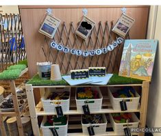 a book shelf with books and other items on it in front of a sign that says congratulations