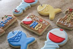 some decorated cookies are sitting on a table