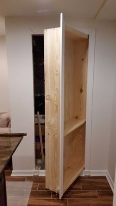 an unfinished pantry in the corner of a room