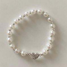 Nwot Faux Pearl Bracelet With Heart Charm. White Pearl Beaded Bracelets With Heart Beads, White Pearl Bracelets With Heart Beads, White Pearl Bracelet With Heart Beads, Elegant White Stretch Bracelet With Heart Beads, White Pearl Heart Bracelet As A Gift, White Pearl Heart Bracelet Gift, White Heart-shaped Pearl Bracelets, Cute White Beaded Heart Bracelet, Cute White Beaded Pearl Bracelet