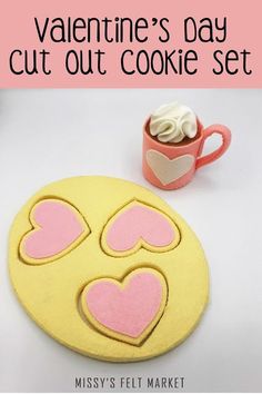 valentine's day cut out cookie set with coffee mug and cupcakes on it