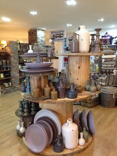 there are many vases and dishes on display in the store's centerpiece