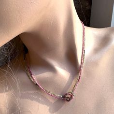 This unique design features micro faceted pink and green tourmalines in a double strand choker with a center focal knot. Enhance your style with this luxurious Tourmaline Knot Necklace finished in a 14K gold fill Spring Ring Clasp. Tourmalines.  Please do not wear this in the shower, swimming or use hair spray, perfumes, etc...directly on it.  You can clean the stones with a soft cloth, if need be. Please keep in provided pouch when not wearing. September Birthstone Jewelry, August Birthstone Jewelry, July Birthstone Jewelry, Zodiac Jewelry, Hair Spray, Jewelry Ring Box, Pearl Jewellery Earrings, Men's Jewelry Rings, Knot Necklace