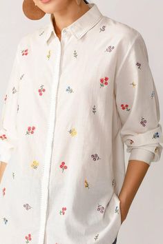 Ecru shirt with floral embroidered motifs and cuff sleeves.
Component: 1
Embroidered
Neckline: Shirt Collar
Sleeve Length: Three quarter
Fabric: Viscose Chanderi
Color: Beige
Note: Pant worn by the model is not for sale - Aza Fashions Spring Long Sleeve Top With Embroidered Cuffs, Spring Long Sleeve Embroidered Top, Spring Cotton Shirt With Embroidered Cuffs, Cotton Embroidered Cuff Long Sleeve Top, Cotton Embroidered Long Sleeve Top, White Cotton Shirt With Embroidered Cuffs, Spring Embroidered Spread Collar Tops, Spring Embroidered Tops With Spread Collar, Long Sleeve Cotton Embroidered Top With Cuffs