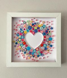 a white frame with buttons in the shape of a heart