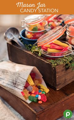 mason jar candy station on a wooden box