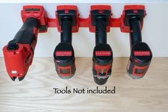 four red and black tools are lined up on a shelf with the words tools not included