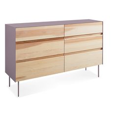 a white and wood dresser with metal legs