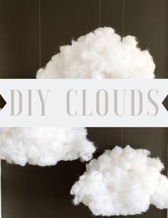 two white clouds hanging from strings with the words diy clouds above them in grey and white