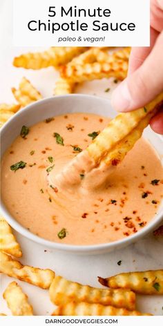 dipping sauce in a white bowl with cheesy breadsticks