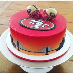 a cake decorated with the san francisco giants logo and two earbuds on top