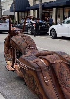 an old fashioned motorcycle is parked on the side of the road