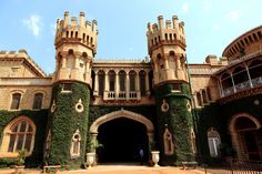 an old castle with ivy growing all over it's walls and entrance to the building