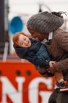 a woman holding a small child in her arms