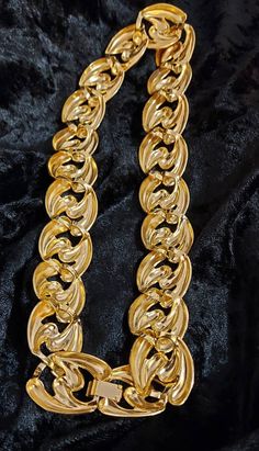 Another fantastic 1980's necklace. This has a fancy link & again can be worn either day or evening. The 80's were a time of big bold jewellery, fashion, music & lifestyles. This necklace has a gold tone & gold over clip clasp. Weight : 93 gms Length : 19.5 cms If you do big & bold retro 80's this is for you! Thank you for looking, you might like some of my other pieces. Gold Chunky Chain Choker For Party, Party Chunky Chain Gold-plated Necklace, Evening Metal Jewelry With Chunky Chain, Evening Chunky Chain Metal Jewelry, Evening Gold-plated Necklace With Gold Chain, Party Gold Plated Chunky Chain Necklace, Gold Plated Chunky Chain Necklace For Party, Gold Plated Gold Chain Necklace For Evening, Evening Gold Plated Gold Chain Necklace