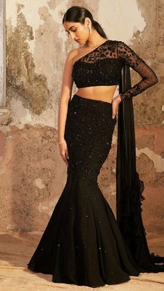 One Off Shoulder Dress Indian, One Off Shoulder Blouse, Black Off Shoulder Lehenga, Black One Shoulder Lehenga, Unique Lenga Design, Black Dress Design Ideas, Off Shoulder Blouse For Lehenga, Fishcut Skirt Outfits, Indian Designer Outfits Gowns Style