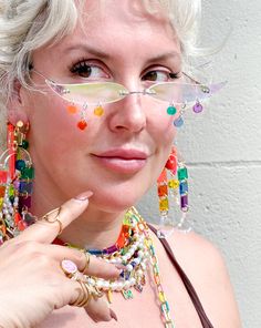 The perfect party glasses for any occasion! Material: 18K Gold Plated Brass; Cubic Zirconia; Transparent Neon Pink, Rust, Yellow, Green, Blue, Purple, & Iridescent Acrylic Handmade in NYC, ready to ship! Not UV protected. Do not wear while driving! We are a small team: processing takes between 1-10 business days, depending on the number of orders. Thank you for your patience! Shipping and Returns policy All sales items are final sale Have questions/need help? We're here for you! help@islynyc.com or reach out in our chat box!#ISLYNYC @ISLYNYC #ISLYicon Handmade Clear Jewelry For Party, Multicolor Plastic Jewelry For Party, Plastic Beaded Jewelry For Party, Fun Plastic Jewelry For Party, Summer Party Clear Jewelry, Rainbow Plastic Party Jewelry, Fun Plastic Party Jewelry, Summer Party Glass Jewelry, White Glass Jewelry For Party