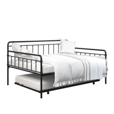 a metal bed frame with white sheets and pillows on it's headboard, in front of a white background