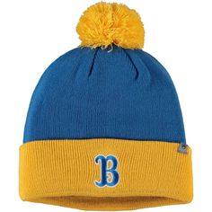 a blue and yellow beanie with the letter b on it