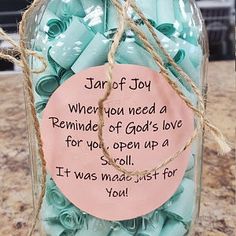 a mason jar filled with blue paper clips and a note saying, star of joy when you need a reminder of god's love for you open up a soul it was made just for you