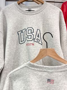 Our USA crew is perfect for the 4th of July! "Tomorrow" embroidered on back corner. 50% cotton, 50% polyester Medium-heavy fabric College Crew Neck Sweats With Embroidered Logo, Cotton Campus Top With Letter Embroidery, Cotton Tops With Letter Embroidery For Campus, Cotton Sweatshirt With Letter Embroidery For Campus, Campus Sweatshirt With Embroidered Graphics And Crew Neck, Collegiate Streetwear Top With Embroidered Text, Crew Neck Sweatshirt With Embroidered Graphics For Campus, Collegiate Style Tops With Embroidered Text For Streetwear, Varsity Cotton Sweatshirt With Embroidered Text