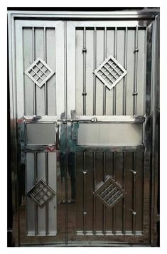 two large metal doors with diamond designs on them