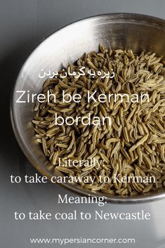 a metal bowl filled with brown rice on top of a table