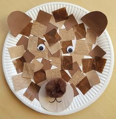 Bear face made from a paper plate, brown paper collage, pompom nose and googly eyes Brown Bear Brown Bear Crafts, Paper Plate Bear, Brown Bear Brown Bear Activities, Brown Bear Book, Playgroup Activities, Fun Collage, Going On A Bear Hunt, Chinese New Year Crafts For Kids