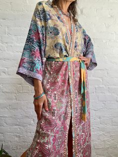 "This is one of a kind patchwork, upcycled silky robe Made free size with wrap tie closing and wide kimono sleeves  Easy and fun to wear around the house or outside as a urban boho style,  flowy kardigan with jeans and tshirt  It is very comfy and feels soft and light  the material is colourful indian saree silk made into this unique stylish over all MEAESURE free size length 55\" MATERIAL *polyester *no lining more available at  https://www.etsy.com/shop/AltheaStores? CARE INSTRUCTIONS  * Wash Bohemian Robes, Urban Boho, Boho Street Style, Patchwork Kimono, Beach Spa, Pink Shawl, Silky Robe, House Coat, Ethnic Chic