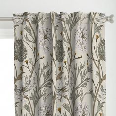 a curtain with flowers and leaves on it