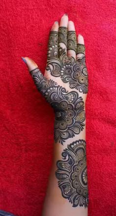 henna tattoo on the palm of a woman's hand