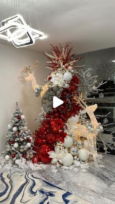 a christmas tree with red and silver decorations