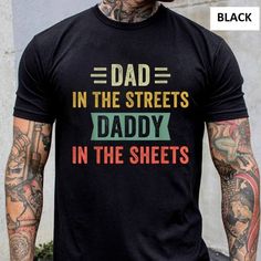 Dad In The Streets Daddy In The Sheets Shirt, Funny Dad Shirt Product Description: - Made From 100% Cotton. - Sizes From S To 3xl. Thanks For Your Visit. Have A Nice Day!!! Father's Day Black Shirt With Graphic Print, Father's Day Black Graphic Print Shirt, Black Graphic Print Shirt For Father's Day, Black Shirt With Funny Text For Father's Day, Black Slogan Shirt For Father's Day, Father's Day Black Shirt With Funny Text, Father's Day Black Slogan Shirt, Black Slogan Top For Father's Day, Black Shirt With Text Print For Father's Day